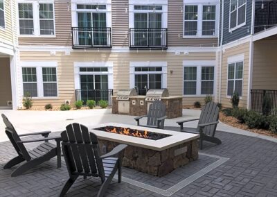 Nexus Luxury Apartments in Virginia Beach courtyard with firepit and griling