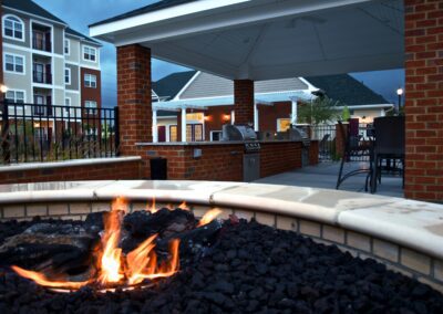 Marcella at Town Center apartment and Townhomes firepit and covered grilling pavilion.